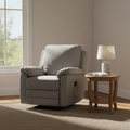 Soft fog-gray fabric power lift recliner chair in a sunlit living room with a wooden side table and small lamp